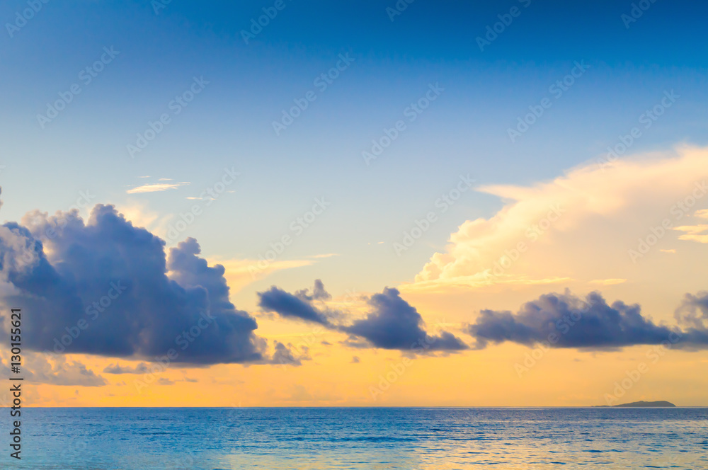The sky at sunrise in the bay Grande Anse. La Digue Island, Seyshelles