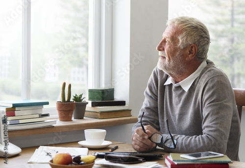 Quadro su tela Senior Adult Looking Outside WIndow Relax Concept