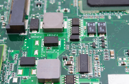 Electronic circuit board close up with chips processor © Aleksei