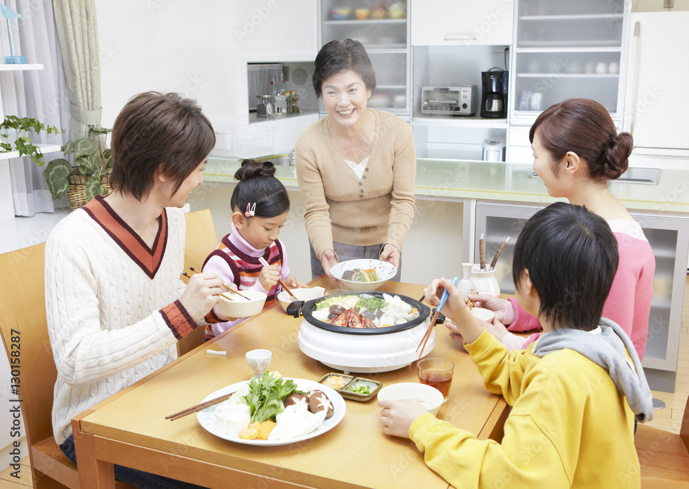 Parents and kids sitting around yosenabe