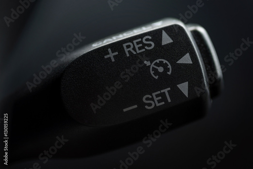 Speed limitation control buttons on modern car. Interior detail.