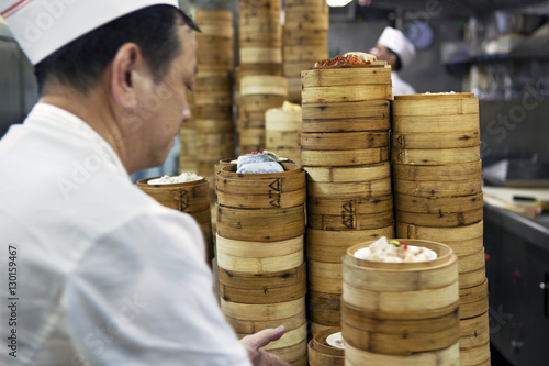 Dim sum preparation in a restaurant kitchen in Hong Kong, China photo