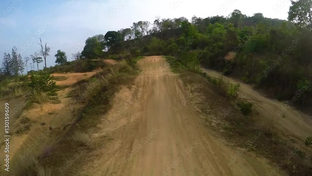 Driving a motocross bike. Driving a motocross bike.