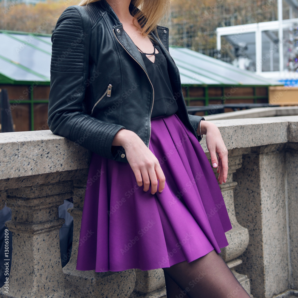 Female scater skirt and leather jacket. Girl wearing sexy fashionable  outfit with black leather jacket and purple circle skirt. Model girl in  fashion skirt.. Stock Photo | Adobe Stock