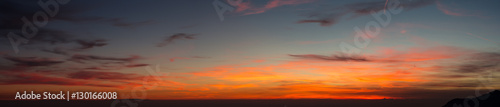 Fototapeta Naklejka Na Ścianę i Meble -  Fiery sunset from mountain pick with thin glazes in the sky evening. Fall season. Orobie alps. Rena pick. Bergamo Italy. In the distance the Monviso.