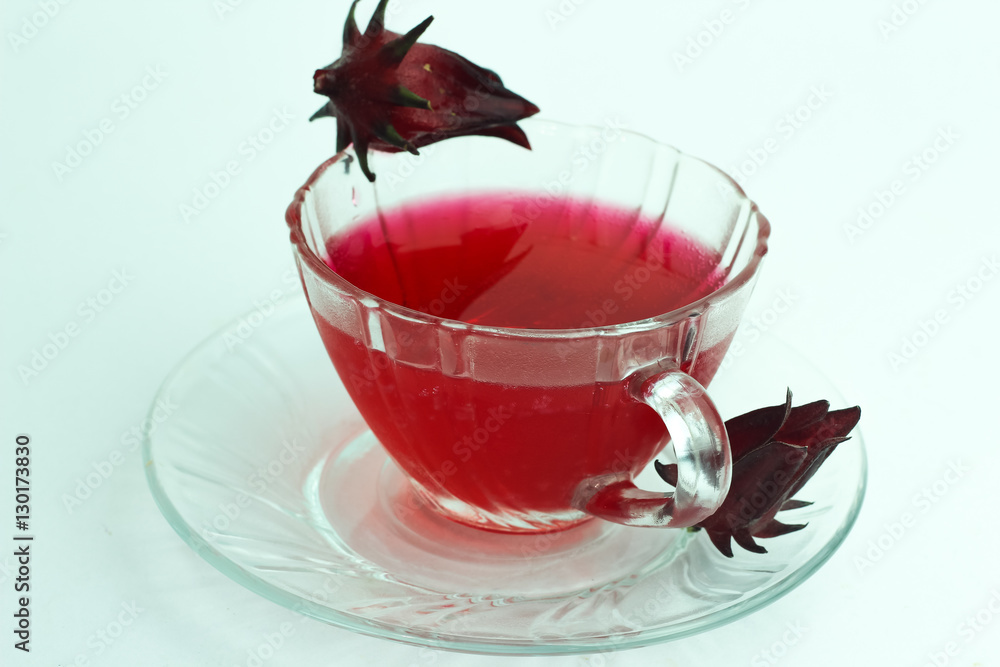 Glass of cold roselle juice - healthy food against wood Glass of cold roselle juice - healthy food against wood