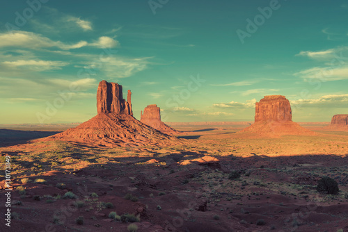 Famous Buttes of Monument Valley at sunset, Utah. Vintage processed. 