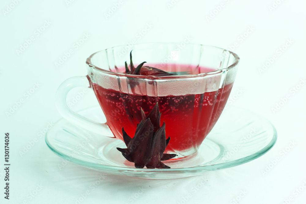Glass of cold roselle juice - healthy food against wood Glass of cold roselle juice - healthy food against wood