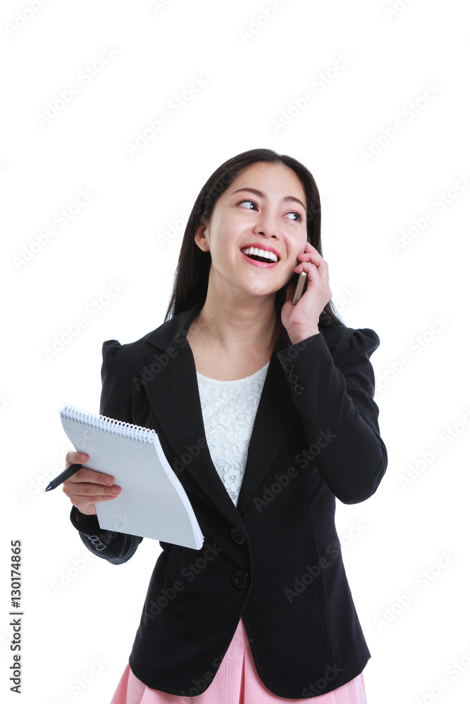 Successful businesswoman talking on the phone and holding note paper Successful businesswoman talking on the phone and holding note paper