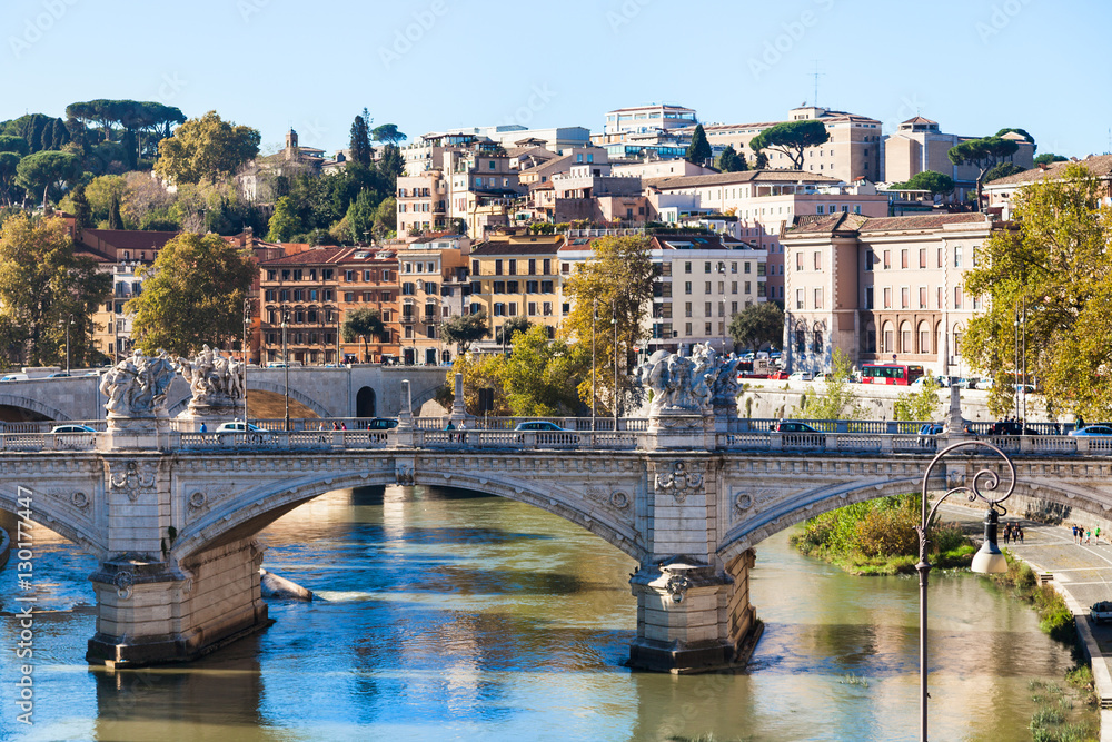 Rome city skyline with Tiber River and bridge