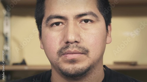 Wallpaper Mural South American man in his thirties looks at the camera Torontodigital.ca