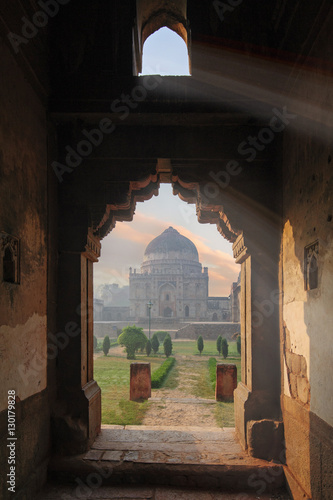 Bada Gumbad Complex at early morning in Lodi Garden Monuments, view through window, Delhi, India