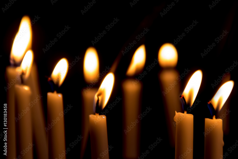 Set of candles in the dark concept of religion Set of candles in the dark concept of religion