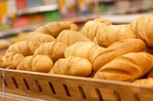 Fresh wheat bread on shelf in supermarket