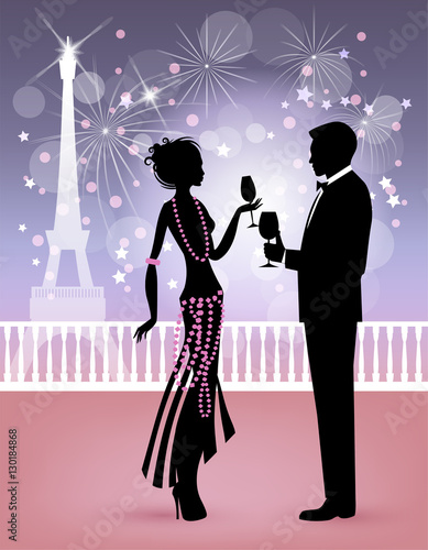 Happy new year in Paris, couple in midnight party with  background of fireworks