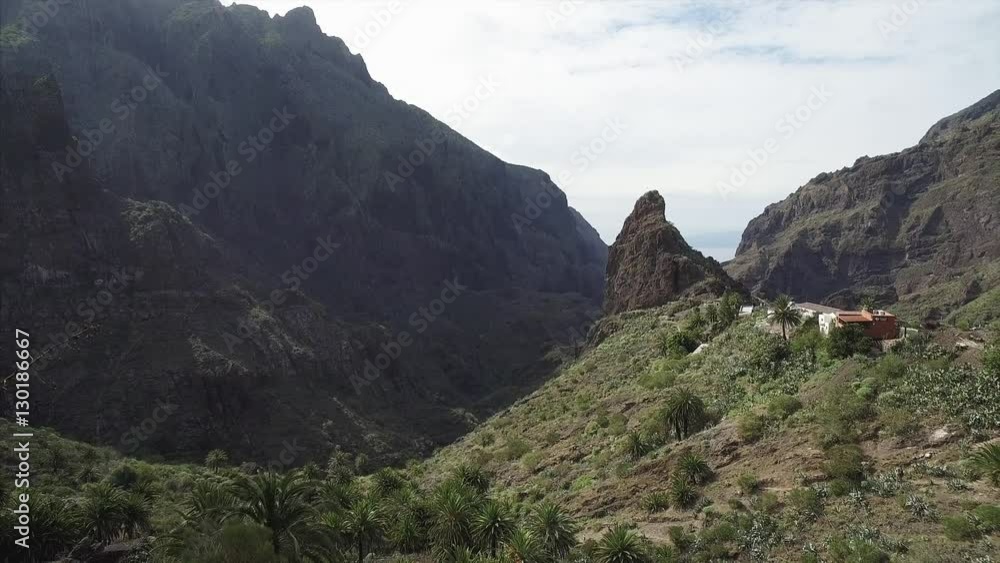 Scenic view of famous Masca ravine leading from village of Masca to shore of Atlantic Ocean. Tenerify Canary Islands, Spain. Scenic view of famous Masca ravine leading from village of Masca to shore of Atlantic Ocean. Tenerify Canary Islands, Spain.