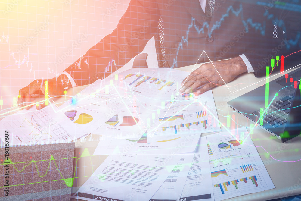 Marketing analysis team meeting concept. Young businessman crew working with new startup project in modern studio. Generic design notebook on wood table. Horizontal, film effect and stock chart graph Marketing analysis team meeting concept. Young businessman crew working with new startup project in modern studio. Generic design notebook on wood table. Horizontal, film effect and stock chart graph