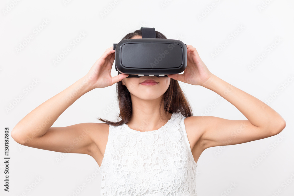Woman watching though virtual reality glasses Woman watching though virtual reality glasses
