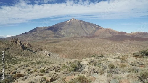 Footage of dramatic volcanic landscape with majetic Teide volcano in a background, Tenerife, Canary Islands, Spain. photo