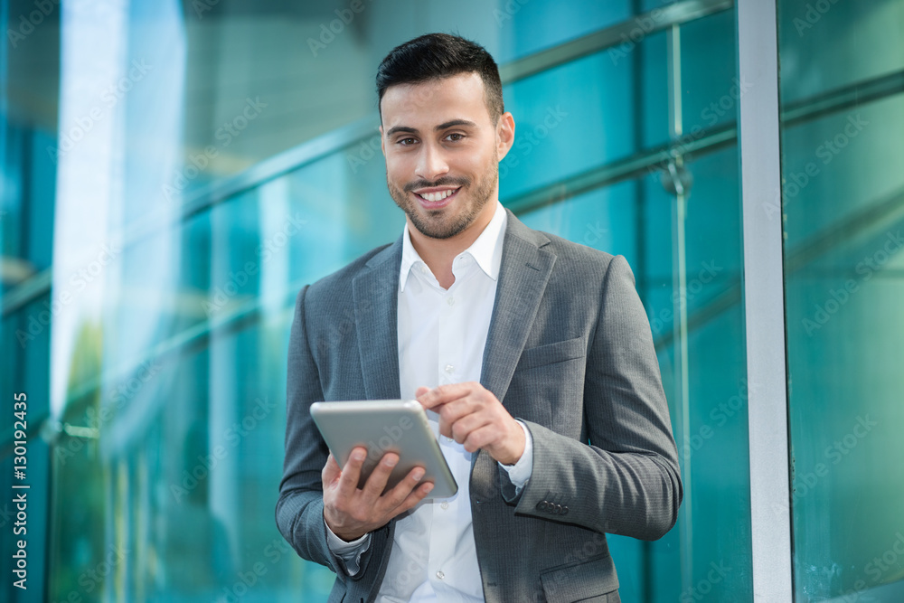 Businessman using his digital tablet Businessman using his digital tablet