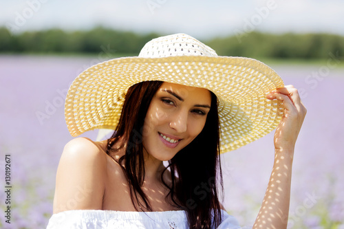 Happy woman in summer field. Young girl relax outdoors. Freedom concept.