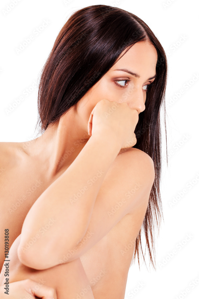 Young nude woman sitting on the floor