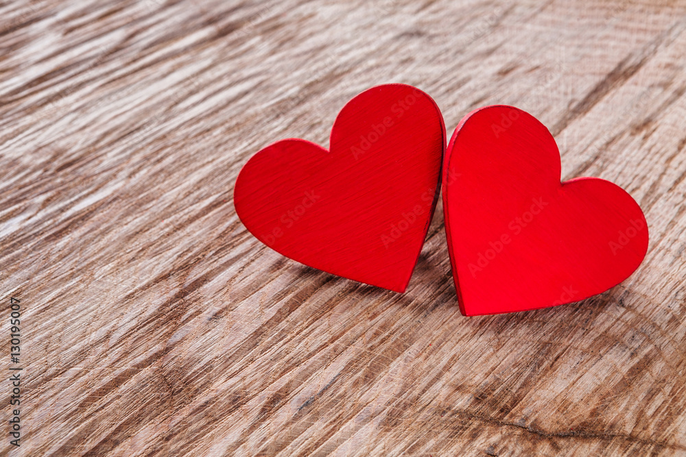 Valentine day background, wooden hearts on wood with copy space Valentine day background, wooden hearts on wood with copy space