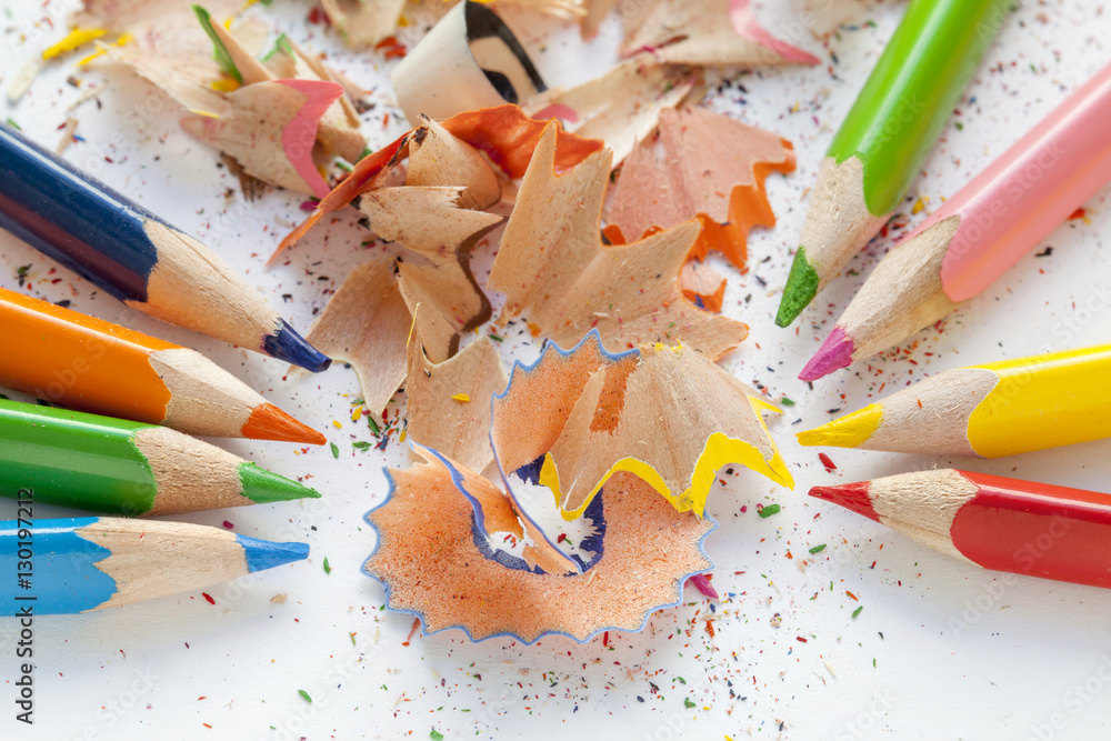 Sharpened colorful pencils and wood shavings Sharpened colorful pencils and wood shavings