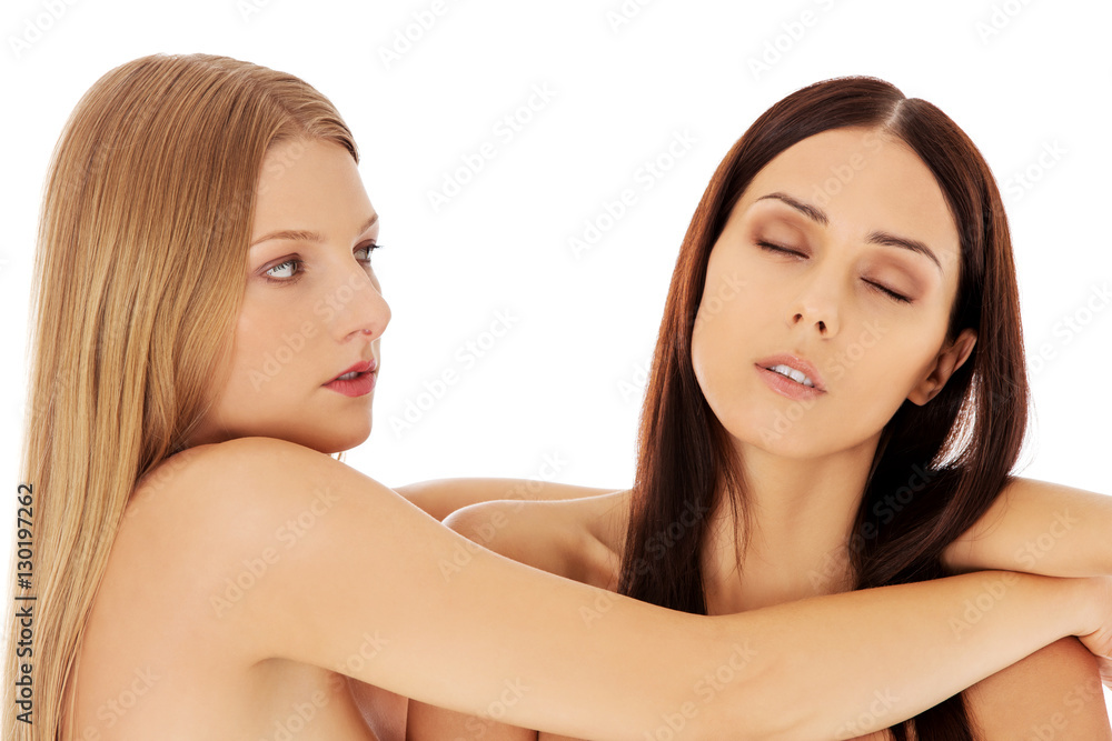 Beauty portrait of a two beautiful young women, studio white Beauty portrait of a two beautiful young women, studio white
