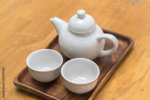 White teapot with a mug
