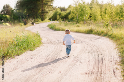 stylish little boy is on his way to his mother