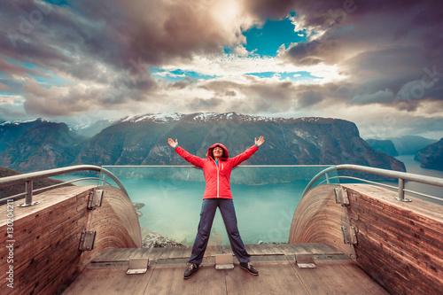 Tourist on Stegastein viewpoint, Norway photo