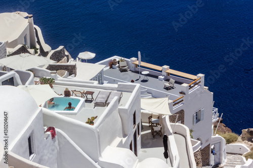 Beautiful view of typical Greek white architecture of Santorini Iceland with swimming pool, Greece