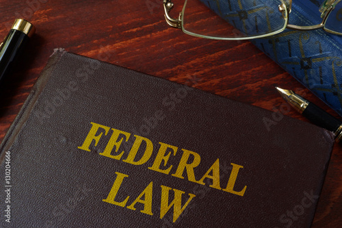 Book with title federal law on a table. photo