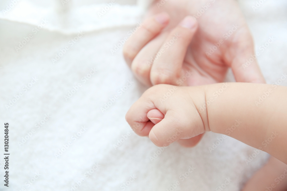 Mother and little baby hands closeup Mother and little baby hands closeup