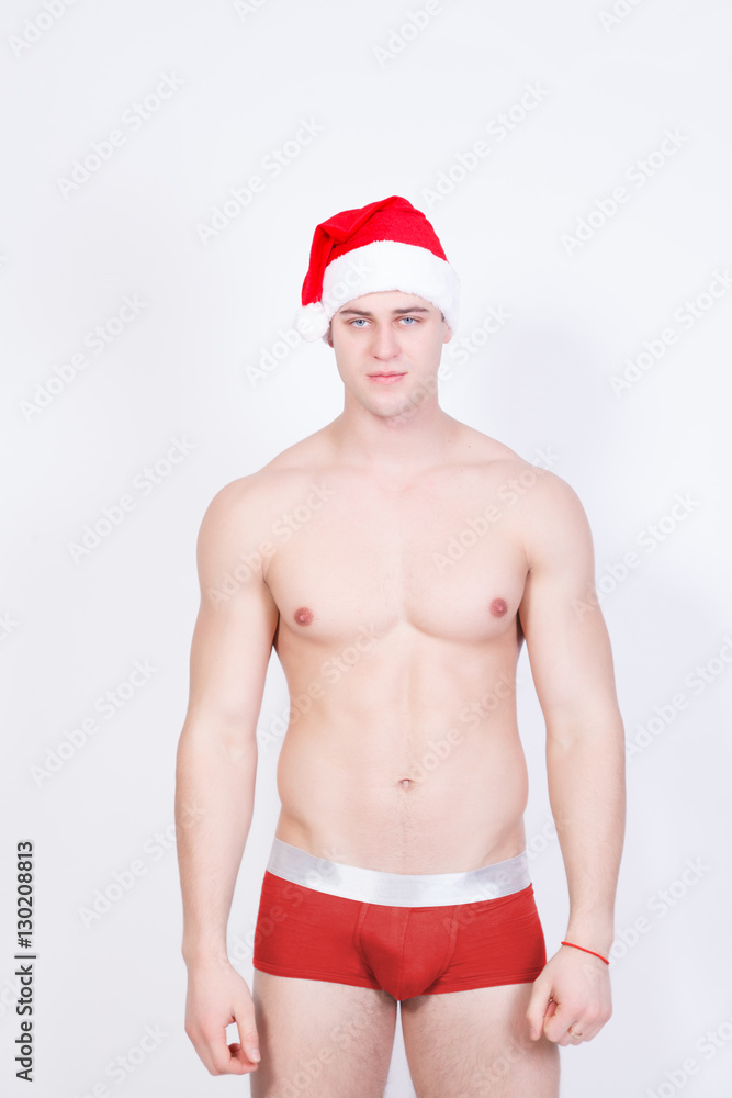 handicap grænseflade damper young handsome sexy macho christmas man in red santa claus hat and red  underwear with muscular bare torso in xmas holiday for new year celebration  on white background Stock Photo | Adobe