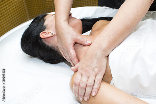 Young girl doing a massage in the beauty salon