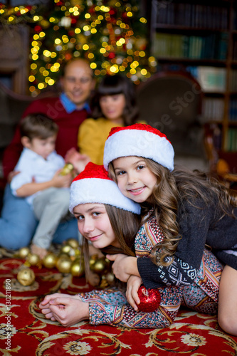 Christmas family of five people, happy parents and their kids