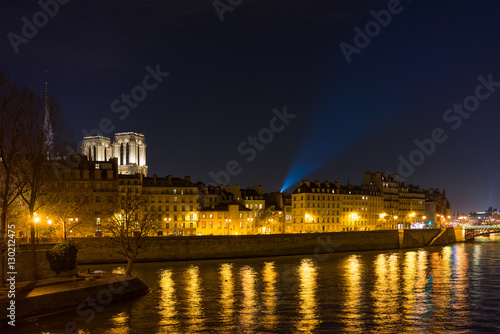 Bridge by the Seine river with view on Notre dame de Paris France