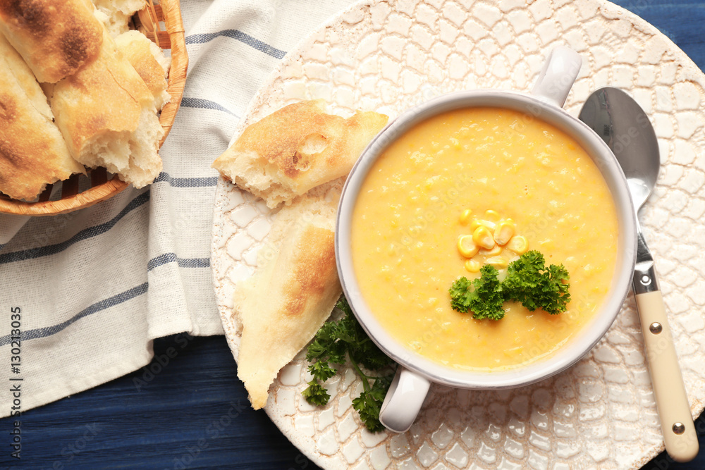 Ταπετσαρία Tasty cornmeal mush with breads and parsley on kitchen table