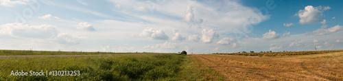 Rural landscape. Panorama of the field after harvest. Summer and autumn in one image, border design panoramic banner