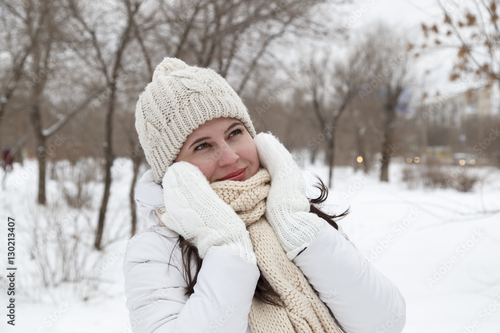 The girl in a winter white down-padded coat The girl in a winter white down-padded coat