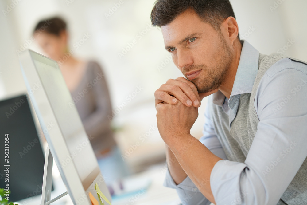 Handsome businessman working for startup company Handsome businessman working for startup company