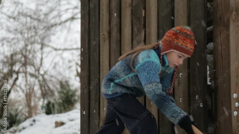 Boy removes snow shovel near the house. Cleaning snow in the winter near the house.
Boy removes snow shovel near the house. Cleaning snow in the winter near the house.