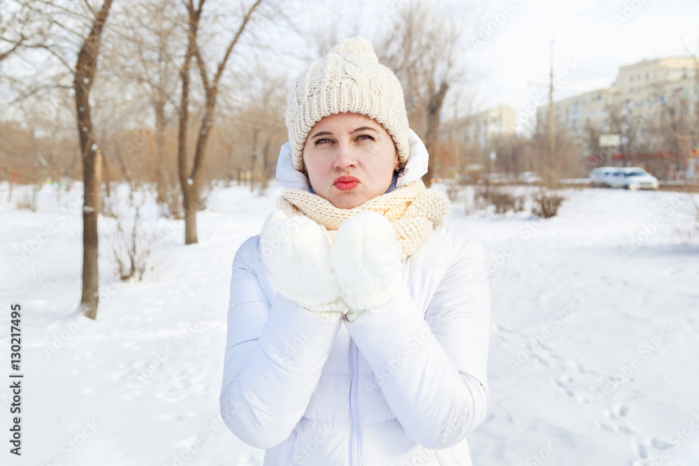 The girl in a winter white down-padded coat The girl in a winter white down-padded coat