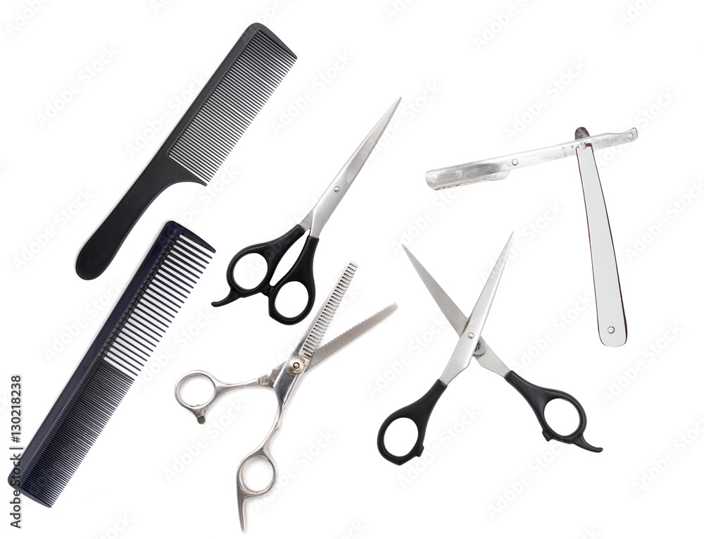 Comb with scissors and razor on a white background