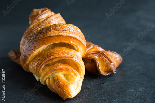 Fresh croissants on a dark background