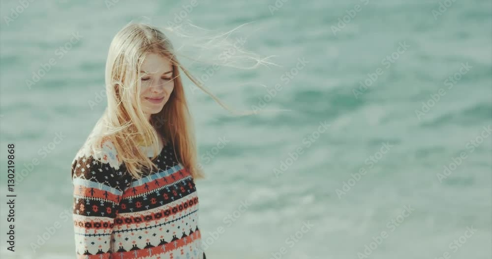 Young blonde Woman enjoying sea Travel Lifestyle happy vacations concept hair blowing in wind Young blonde Woman enjoying sea Travel Lifestyle happy vacations concept hair blowing in wind