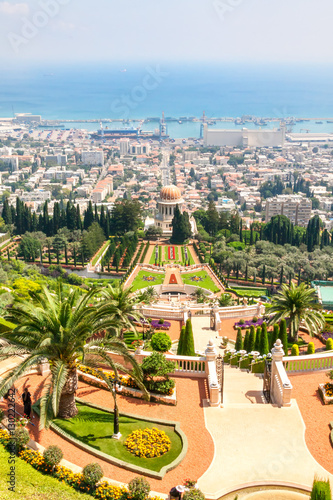 View on Bahai garden terraces with Shrine of Bab against harbor background. Haifa, Israel. photo