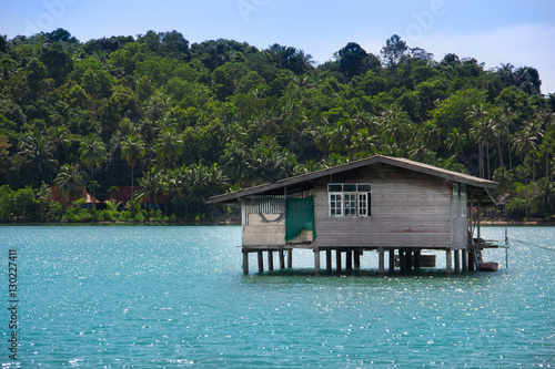 Paradise view on house on stilts in tropical country. Travel and vacation concept. Summer in Thailand © Michael Traitov 